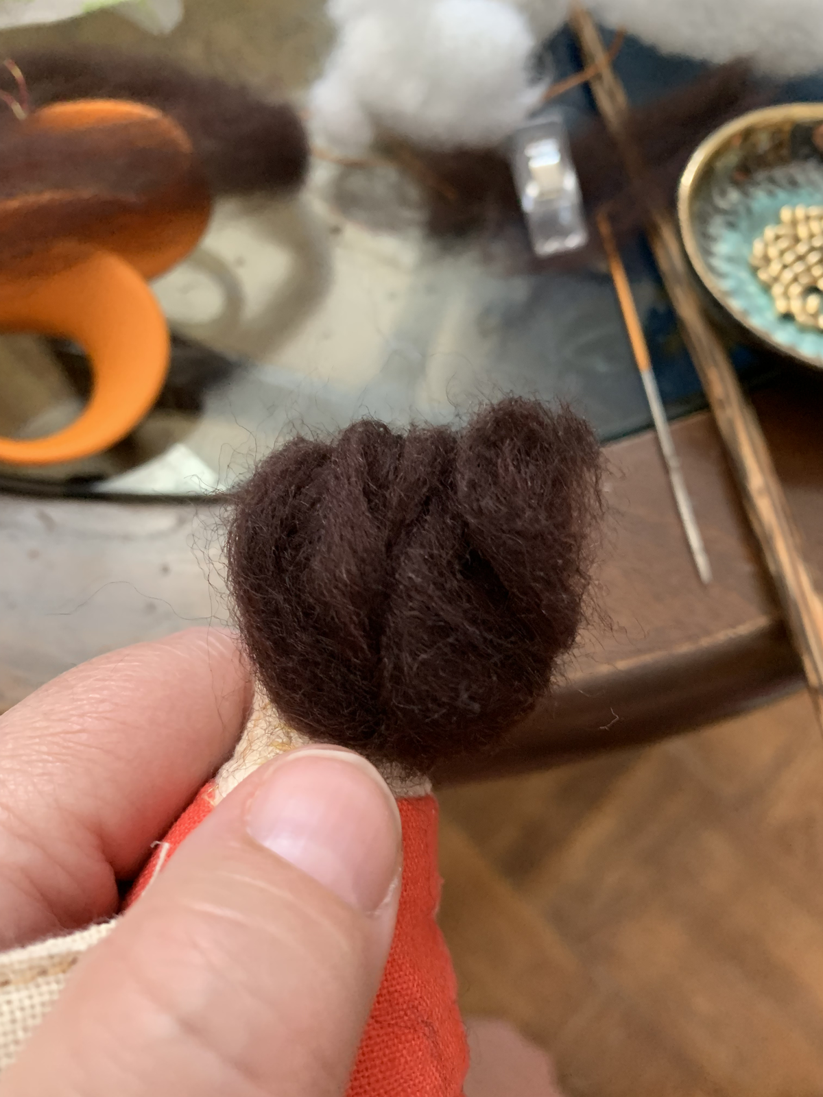 Back of genealogy doll head — dark felted wool hair detail